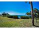 Lush green lawn leads to ocean views, creating a serene and inviting outdoor space at 1723 Gulf Rd # 104, Tarpon Springs, FL 34689