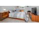 Cozy bedroom with light walls, wood accents, and plenty of natural light at 1723 Gulf Rd # 104, Tarpon Springs, FL 34689