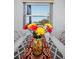 Close-up of dining table decorated with flowers and a decorative runner at 1723 Gulf Rd # 104, Tarpon Springs, FL 34689