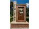 Historical Tarpon Springs welcome sign, adorned with a classic diver's helmet and brick surround at 1723 Gulf Rd # 104, Tarpon Springs, FL 34689