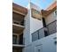 Exterior view of condo building with attractive signage and well-maintained landscaping at 1723 Gulf Rd # 104, Tarpon Springs, FL 34689