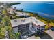 This stylish condo boasts multiple balconies with serene water views and mature landscaping at 1723 Gulf Rd # 104, Tarpon Springs, FL 34689