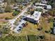 This building has a parking lot and some lovely palm trees on a sunny day at 1723 Gulf Rd # 104, Tarpon Springs, FL 34689