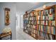 Hallway view featuring a built-in bookcase and tiled floor at 1723 Gulf Rd # 104, Tarpon Springs, FL 34689