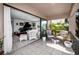 Inviting outdoor patio with stylish furniture and seamless indoor/outdoor flow at 1723 Gulf Rd # 104, Tarpon Springs, FL 34689