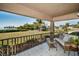 Peaceful outdoor patio with seating area, offering a tranquil view of the surrounding landscape at 1723 Gulf Rd # 104, Tarpon Springs, FL 34689