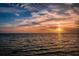 Water view sunset casting vivid colors across the sky at 1723 Gulf Rd # 104, Tarpon Springs, FL 34689