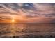 Beautiful waterfront sunset reflecting on the water at 1723 Gulf Rd # 104, Tarpon Springs, FL 34689