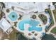 Stunning aerial view of the community pool, including water features, seating, and the community center at 18629 Coastal Shore Ter, Land O Lakes, FL 34638