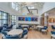 Bright community center with media center and tables for gathering and relaxation at 18629 Coastal Shore Ter, Land O Lakes, FL 34638