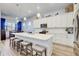 Bright kitchen with an island with seating, modern appliances, and plenty of storage space with lots of cabinets at 18629 Coastal Shore Ter, Land O Lakes, FL 34638