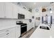 Bright kitchen with modern appliances, white countertops and cabinetry for an open and airy feel at 18629 Coastal Shore Ter, Land O Lakes, FL 34638