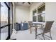 Comfortable lanai with outdoor dining area, sink and mini fridge for easy outdoor entertaining at 18629 Coastal Shore Ter, Land O Lakes, FL 34638