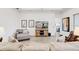 Comfortable living room featuring modern decor, a large television, and ample seating at 18629 Coastal Shore Ter, Land O Lakes, FL 34638