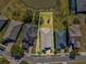 Aerial view showcasing the property's layout and location within a residential neighborhood and pond at 19504 Lily Pond Ct, Brooksville, FL 34601