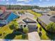 Overhead view of the home with a scenic pond backdrop, emphasizing the property's peaceful setting at 19504 Lily Pond Ct, Brooksville, FL 34601