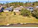 Backyard view features a grassy lawn and pond, perfect for outdoor enjoyment and relaxation at 19504 Lily Pond Ct, Brooksville, FL 34601