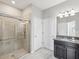 Bathroom featuring walk-in shower and granite vanity at 19504 Lily Pond Ct, Brooksville, FL 34601