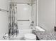 Bathroom featuring tiled shower/tub combination and granite countertop at 19504 Lily Pond Ct, Brooksville, FL 34601