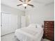 Bright bedroom featuring closet, dresser, and light walls at 19504 Lily Pond Ct, Brooksville, FL 34601