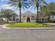 Elegant clubhouse features classic architecture, pristine landscaping, and a welcoming entrance at 19504 Lily Pond Ct, Brooksville, FL 34601