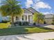 Beautiful home with manicured lawn and palm trees, showcasing a well-maintained exterior at 19504 Lily Pond Ct, Brooksville, FL 34601