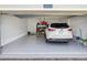 Spacious two car garage featuring epoxy flooring and ample storage at 19504 Lily Pond Ct, Brooksville, FL 34601