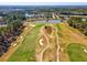 An aerial view highlights the golf course, with its winding paths and scenic water features at 19504 Lily Pond Ct, Brooksville, FL 34601