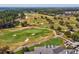 Aerial view of golf course showcasing lush fairways, sand traps, and manicured greens at 19504 Lily Pond Ct, Brooksville, FL 34601