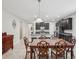 Bright, modern kitchen with granite countertops, stainless steel appliances, and an island at 19504 Lily Pond Ct, Brooksville, FL 34601