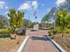 Scenic view of the Memorial Garden featuring brick-paved pathway and flag display at 19504 Lily Pond Ct, Brooksville, FL 34601
