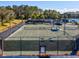 Experience premier tennis with lit courts, shaded rest areas, and park like setting with views of community pond at 19504 Lily Pond Ct, Brooksville, FL 34601