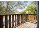 Outdoor balcony view showcases the surrounding greenery and neighborhood, providing a serene escape at 2101 Sunset Point Rd # 2706, Clearwater, FL 33765