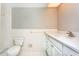 White bathroom featuring new fixtures and tile, with a shower and vanity with plenty of storage at 2101 Sunset Point Rd # 2706, Clearwater, FL 33765