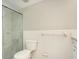 Bathroom featuring white tile, chrome shower fixtures, and a glass-enclosed shower at 2101 Sunset Point Rd # 2706, Clearwater, FL 33765