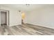 Neutral bedroom with vinyl flooring, a vanity area, and a walk-in closet for storage and organization at 2101 Sunset Point Rd # 2706, Clearwater, FL 33765