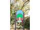 Raintree Village community sign with trees and clear address number at 2101 Sunset Point Rd # 2706, Clearwater, FL 33765
