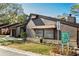 Brown exterior with white brick accents and well-manicured landscaping creates a welcoming atmosphere at 2101 Sunset Point Rd # 2706, Clearwater, FL 33765