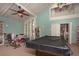 Game room with a billiards table, workout equipment, and ample seating at 2101 Sunset Point Rd # 2706, Clearwater, FL 33765