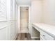 Bright hallway with built in desk, vinyl flooring, closet, and access to bathroom and other rooms at 2101 Sunset Point Rd # 2706, Clearwater, FL 33765