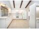 Updated kitchen with white cabinets, modern appliances, and plenty of counter space at 2101 Sunset Point Rd # 2706, Clearwater, FL 33765