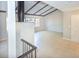 Open-concept living room with vaulted ceilings, tile flooring, and cozy brick fireplace at 2101 Sunset Point Rd # 2706, Clearwater, FL 33765