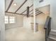 Open-concept living area featuring a fireplace, neutral tile floors, and vaulted ceilings at 2101 Sunset Point Rd # 2706, Clearwater, FL 33765