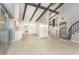 Bright living room featuring vaulted ceilings, exposed beams, and an open floor plan perfect for entertaining at 2101 Sunset Point Rd # 2706, Clearwater, FL 33765