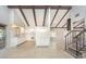 Bright living room featuring vaulted ceilings, exposed beams, and an open floor plan perfect for entertaining at 2101 Sunset Point Rd # 2706, Clearwater, FL 33765