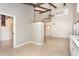 Bright living room featuring vaulted ceilings, exposed beams, and an open floor plan perfect for entertaining at 2101 Sunset Point Rd # 2706, Clearwater, FL 33765