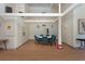 A bright community meeting room with a large table and comfortable seating at 2101 Sunset Point Rd # 2706, Clearwater, FL 33765