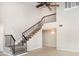 Stylish staircase featuring modern railings and design details connecting multiple levels of the home at 2101 Sunset Point Rd # 2706, Clearwater, FL 33765