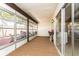 Sun room with wall to wall windows and a separate entrance at 2101 Sunset Point Rd # 2706, Clearwater, FL 33765