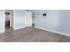 Bedroom view displaying a view into the bathroom and featuring modern flooring and neutral wall color at 2440 Winding Creek Blvd # 305, Clearwater, FL 33761